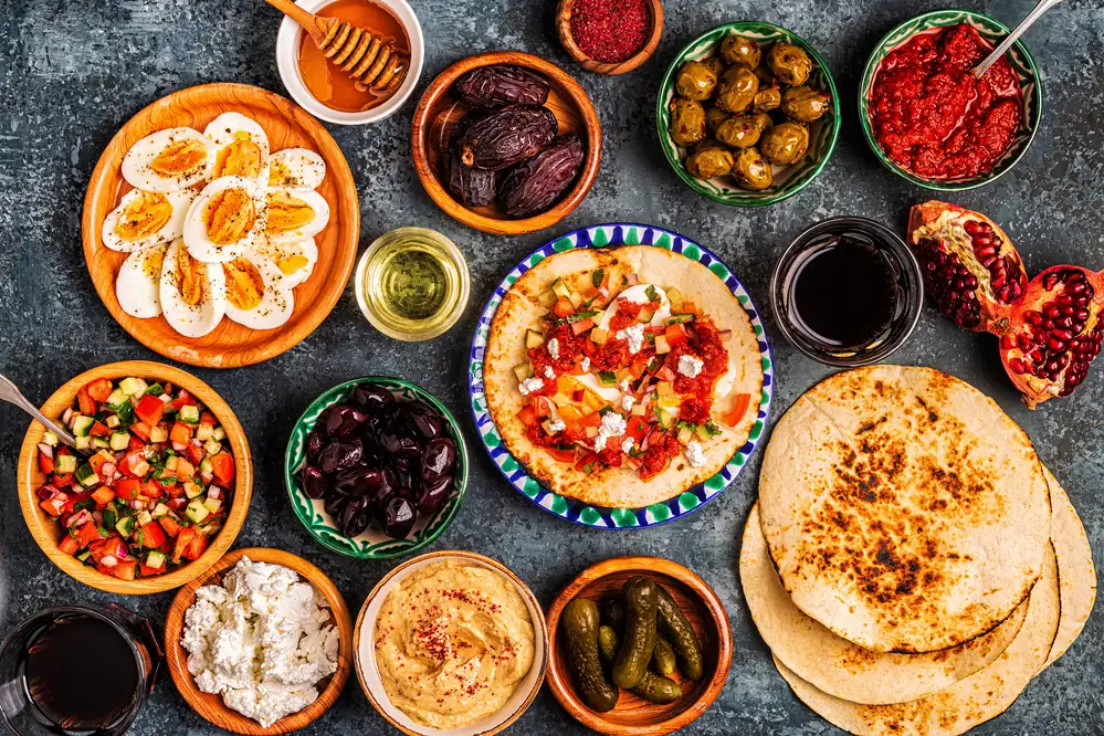 Mediterranean diet & seafood soup: the secret to gut health and longevity 1 Mediterranean diet healthy meal with fresh vegetables, olive oil, fish, and grains for heart health and balanced nutrition