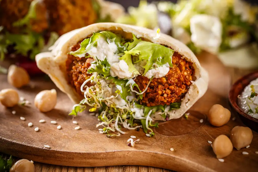 Ultimate falafel sandwich guide: step-by-step recipe, tips & nutrition 3 Delicious falafel sandwich with fresh vegetables and sauce in ledbetter dr dallas, oak cliff, cockrell hill, and surrounding areas