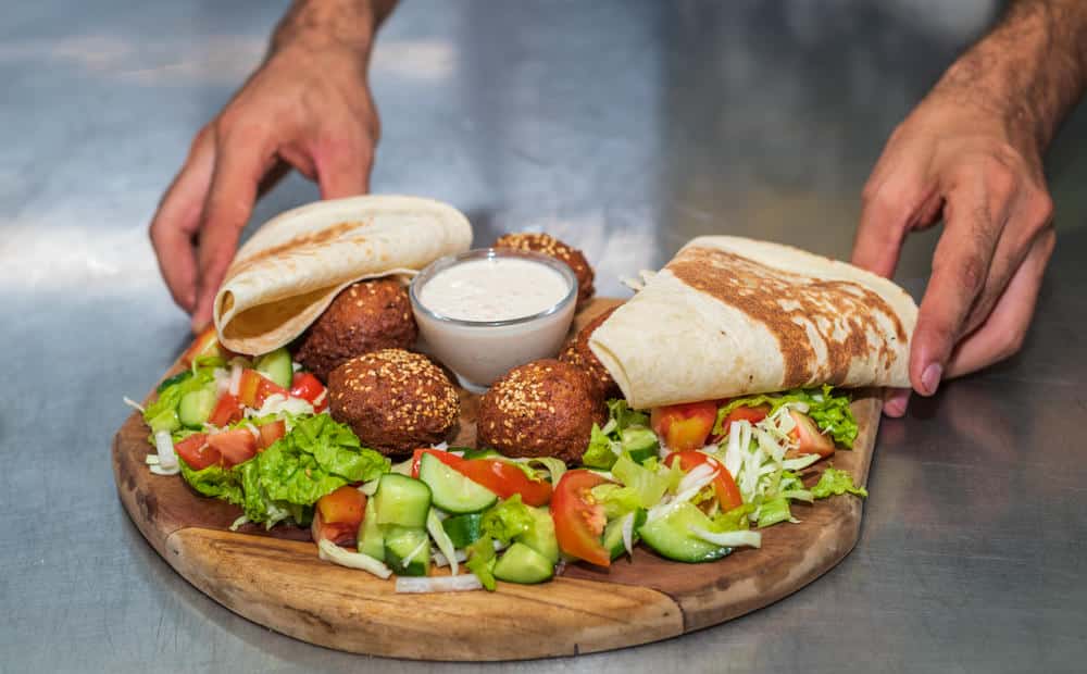 Healthy middle eastern falafel: recipe, nutrition facts, and pro tips 4 Fresh falafel with pita bread and salad in ledbetter dallas tx